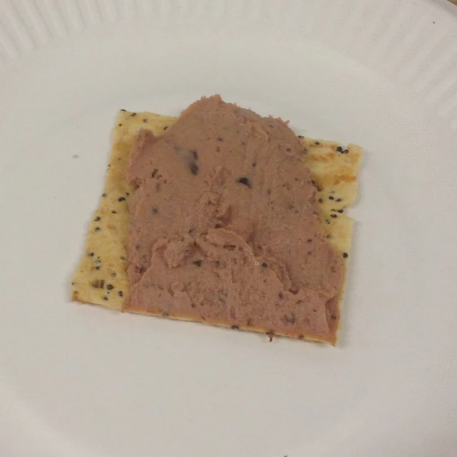 a white paper plate with some food on it