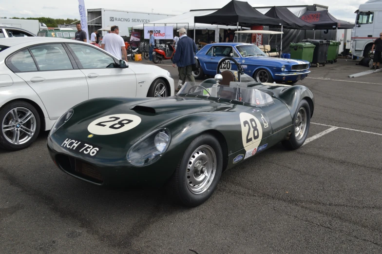 a race car in a lot at a car show