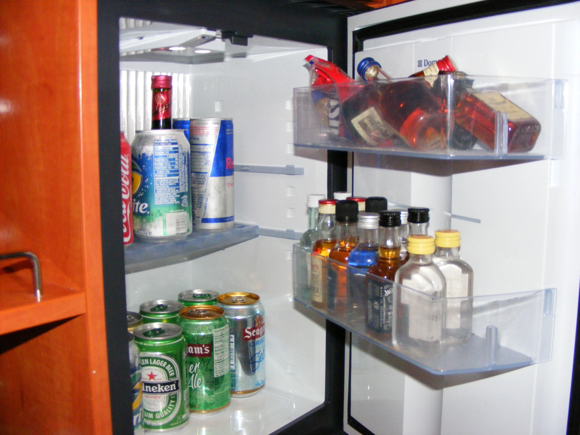 an open refrigerator filled with lots of drinks