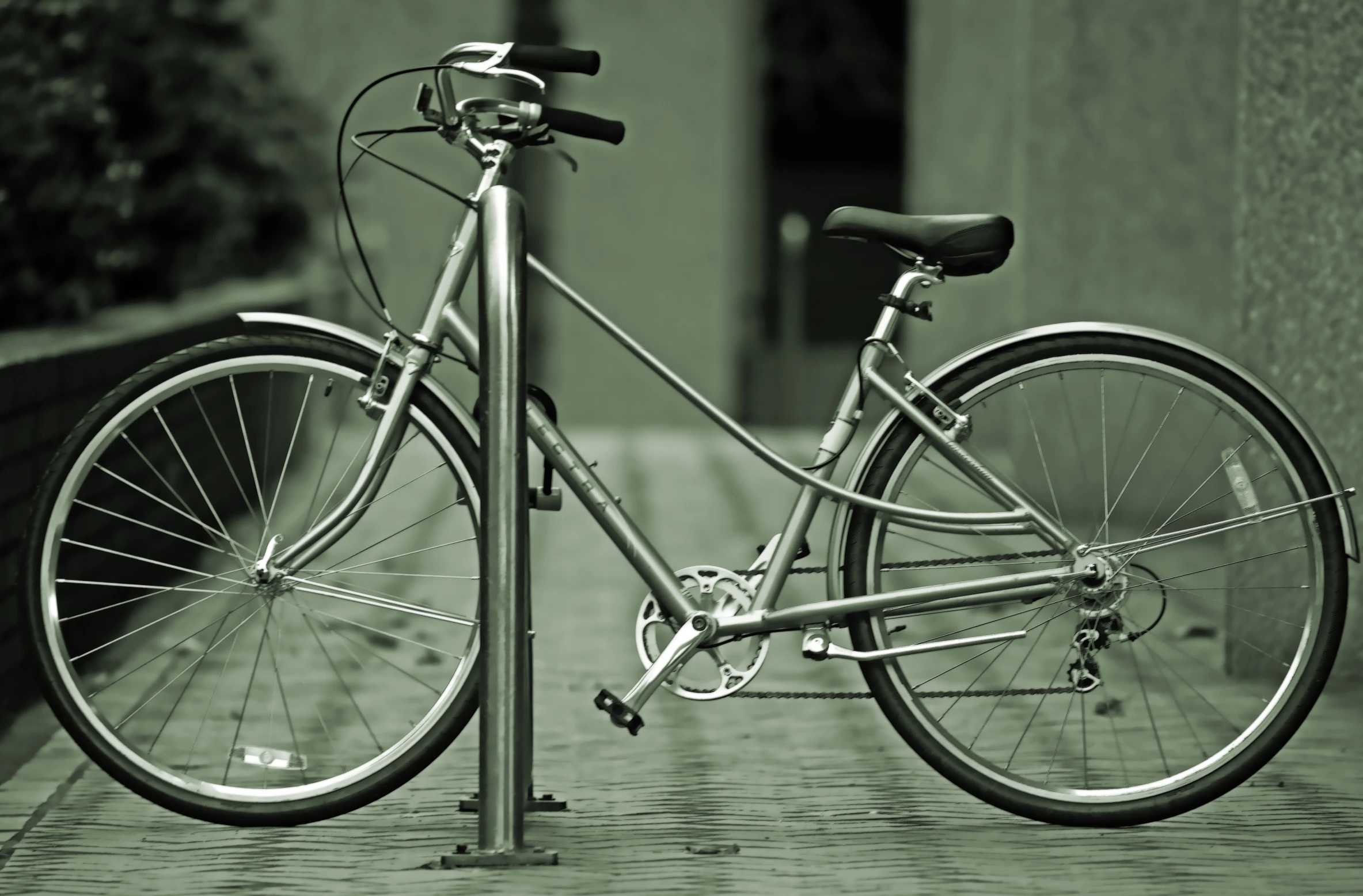 a bike that is sitting up against a pole