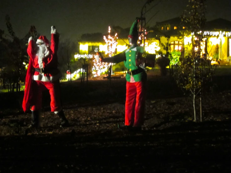 two people dressed in costumes and holding signs