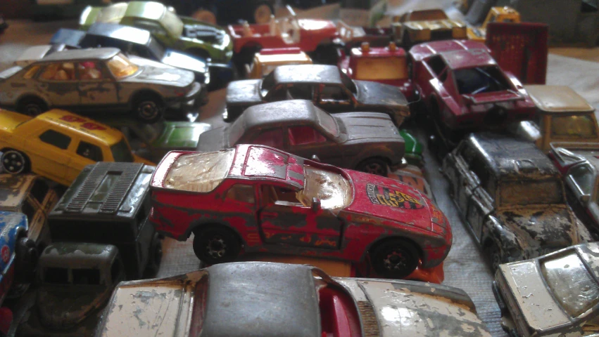 many toy cars stacked on top of each other