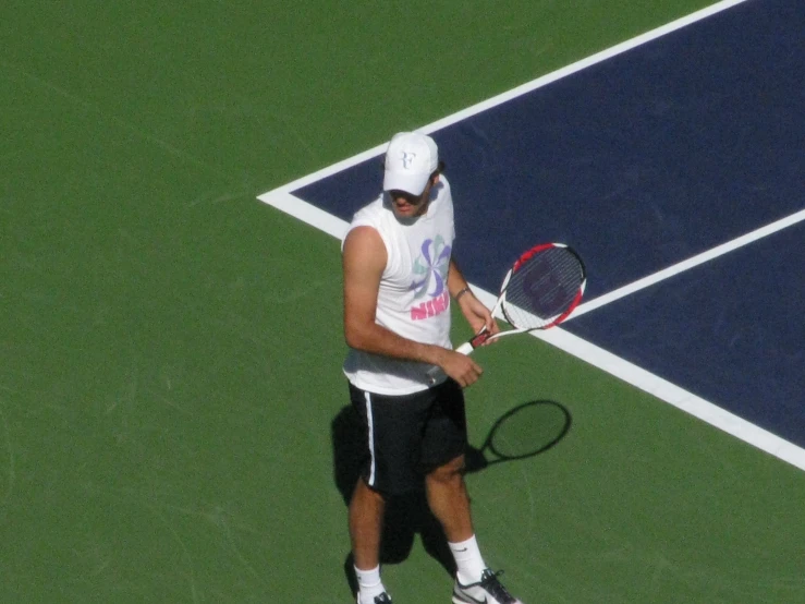a man is wearing shorts and a white headband