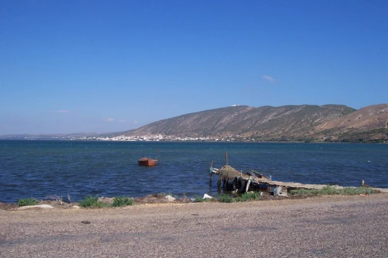 some kind of small boat sitting on the water