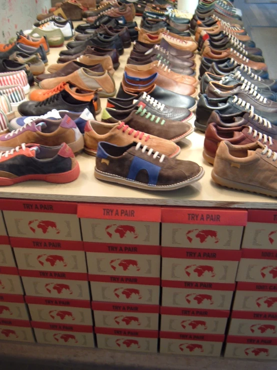 a display of many shoes of various colors
