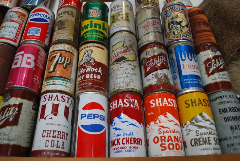 many different types of cans are stacked together