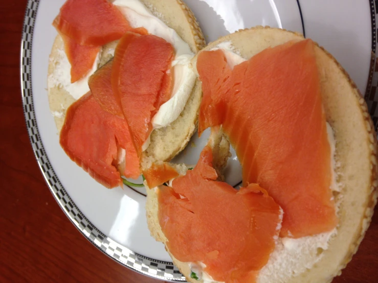 a sandwich on a white plate sitting on a table