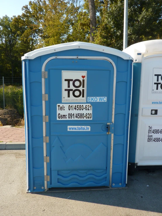 a portable toilet that looks like it's out side