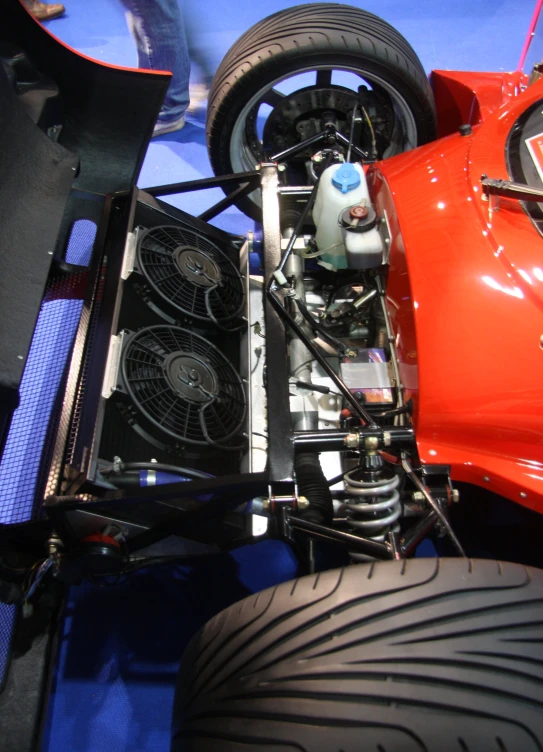 the engine compartment is in focus with the car model showing