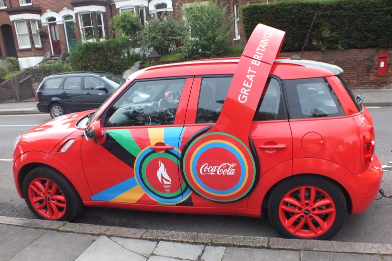 the small car is painted with circles