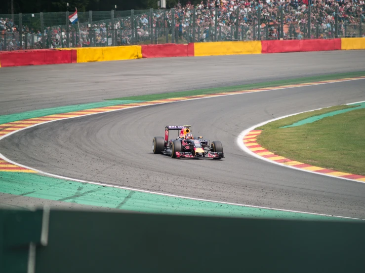 a racing car speeds on the track in a race