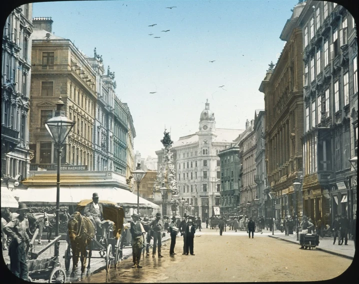 a crowd of people are walking down a street