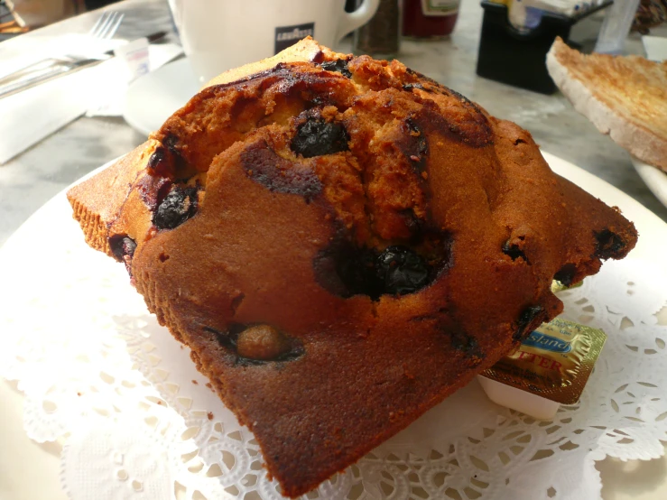 a slice of chocolate chip muffin with a bite taken out