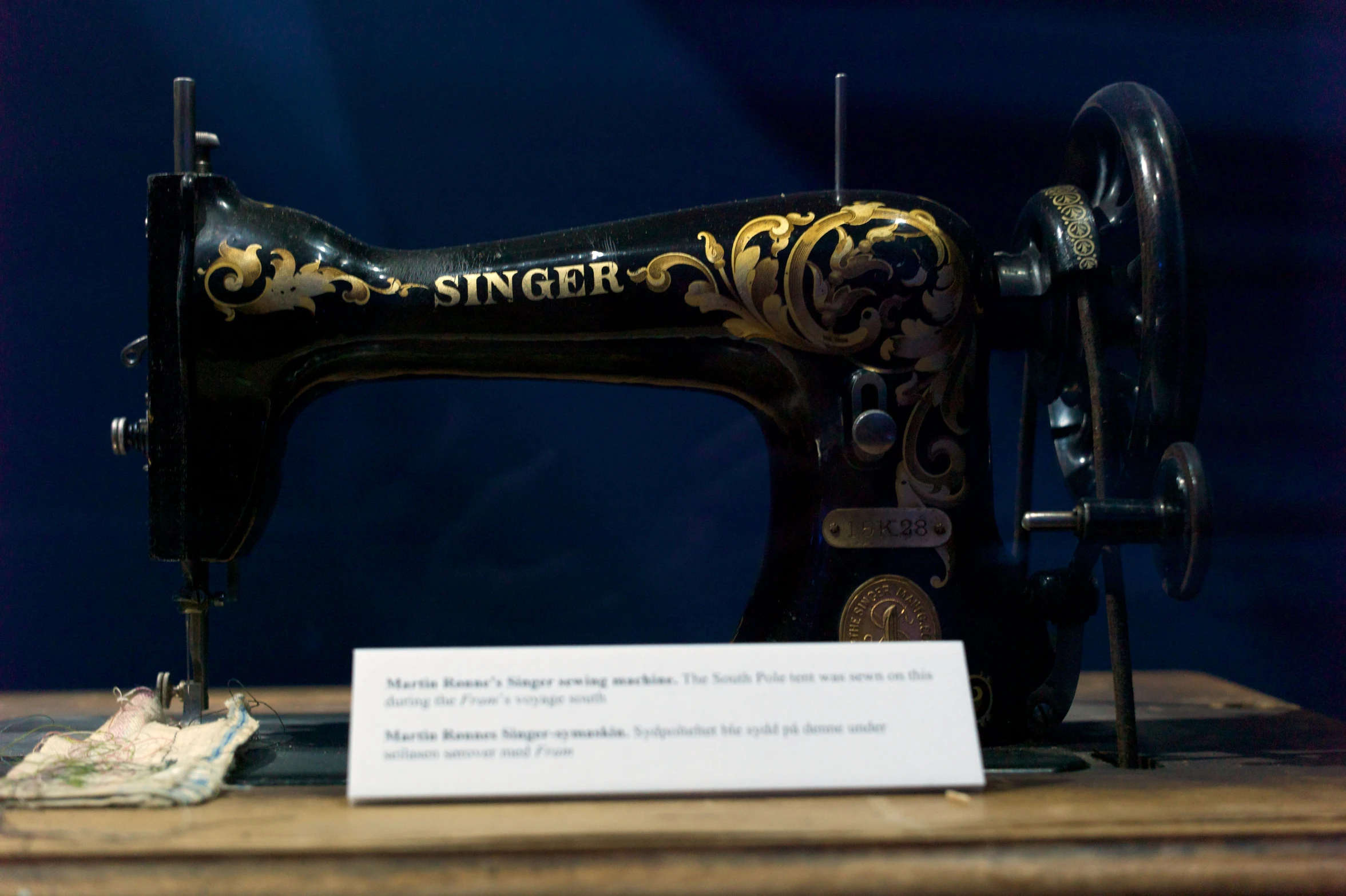 an antique sewing machine on display on a table