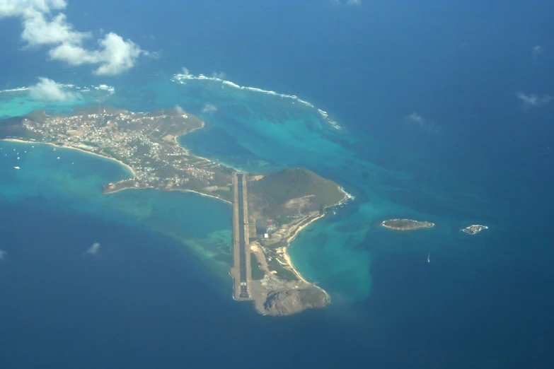 an aerial view of an island and sea