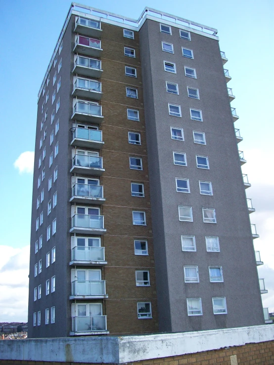 the building is tall with many windows on it