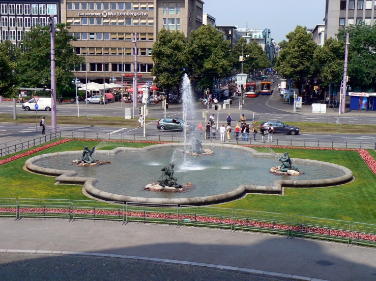 an aerial view of a park with people walking on the pathway