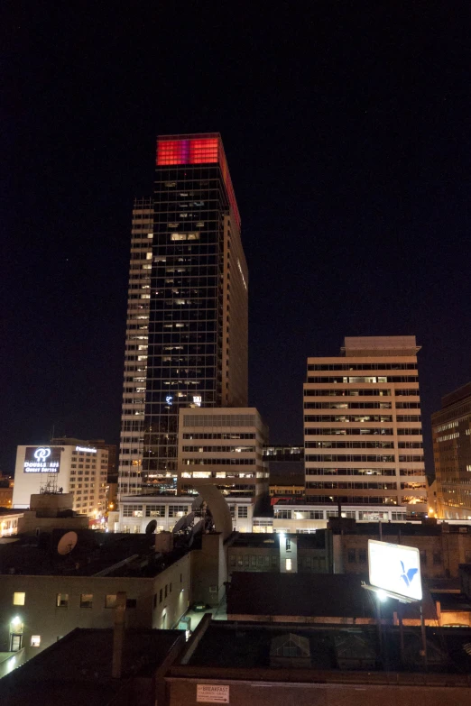 a few buildings are seen with red light at night