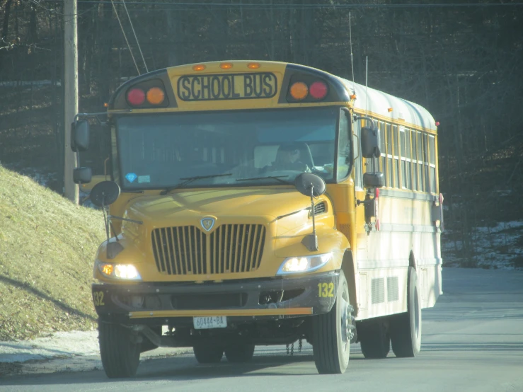 a school bus on a street with snow on the ground