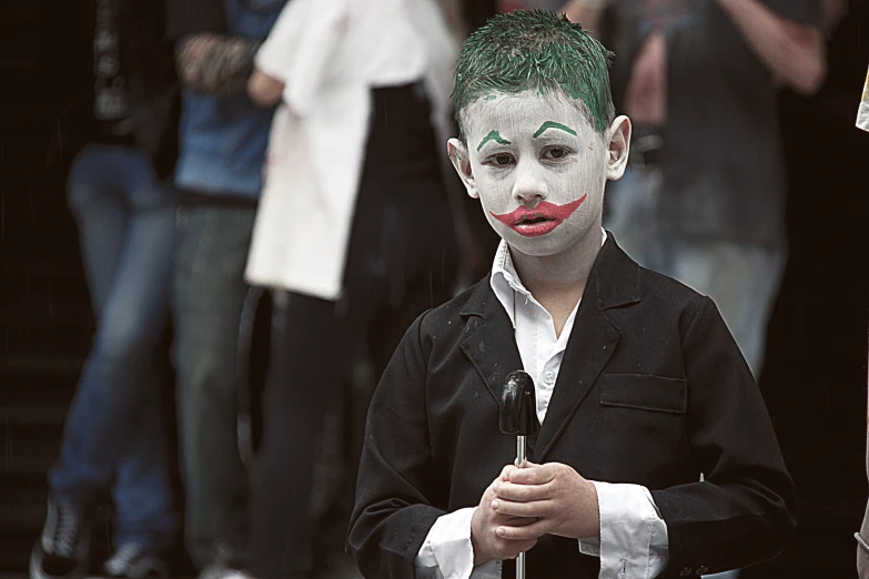 there is a young child dressed up as the joker