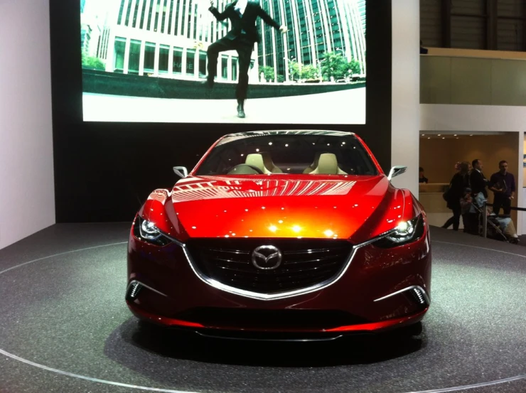 a red sports car that is on display