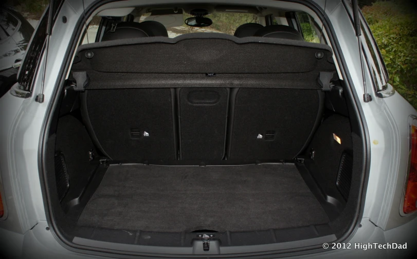 a grey car with luggage compartment and front hatch opened