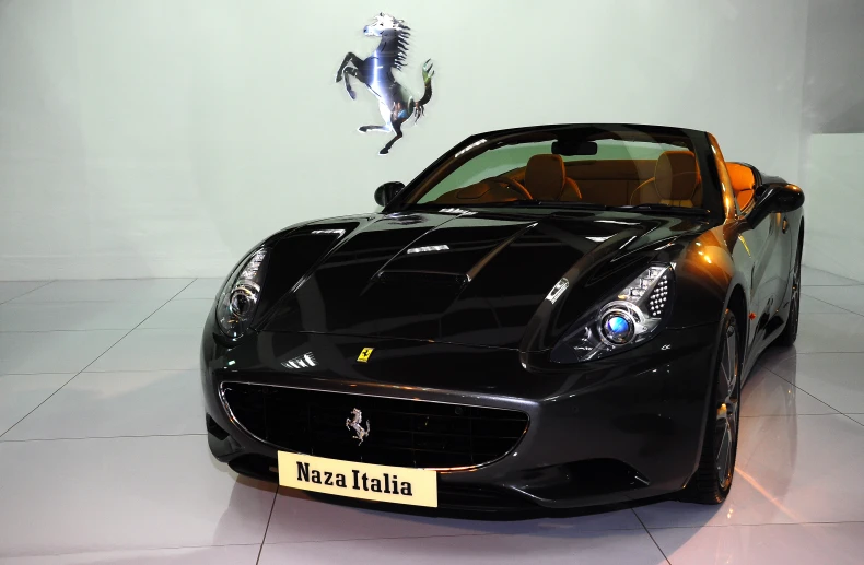 a ferrari sport car is displayed in a room