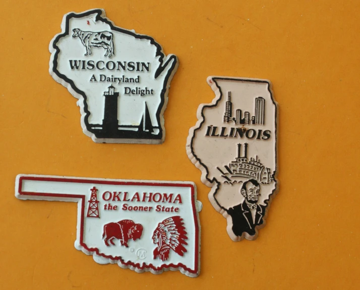 three state stickers that show the location of some sort