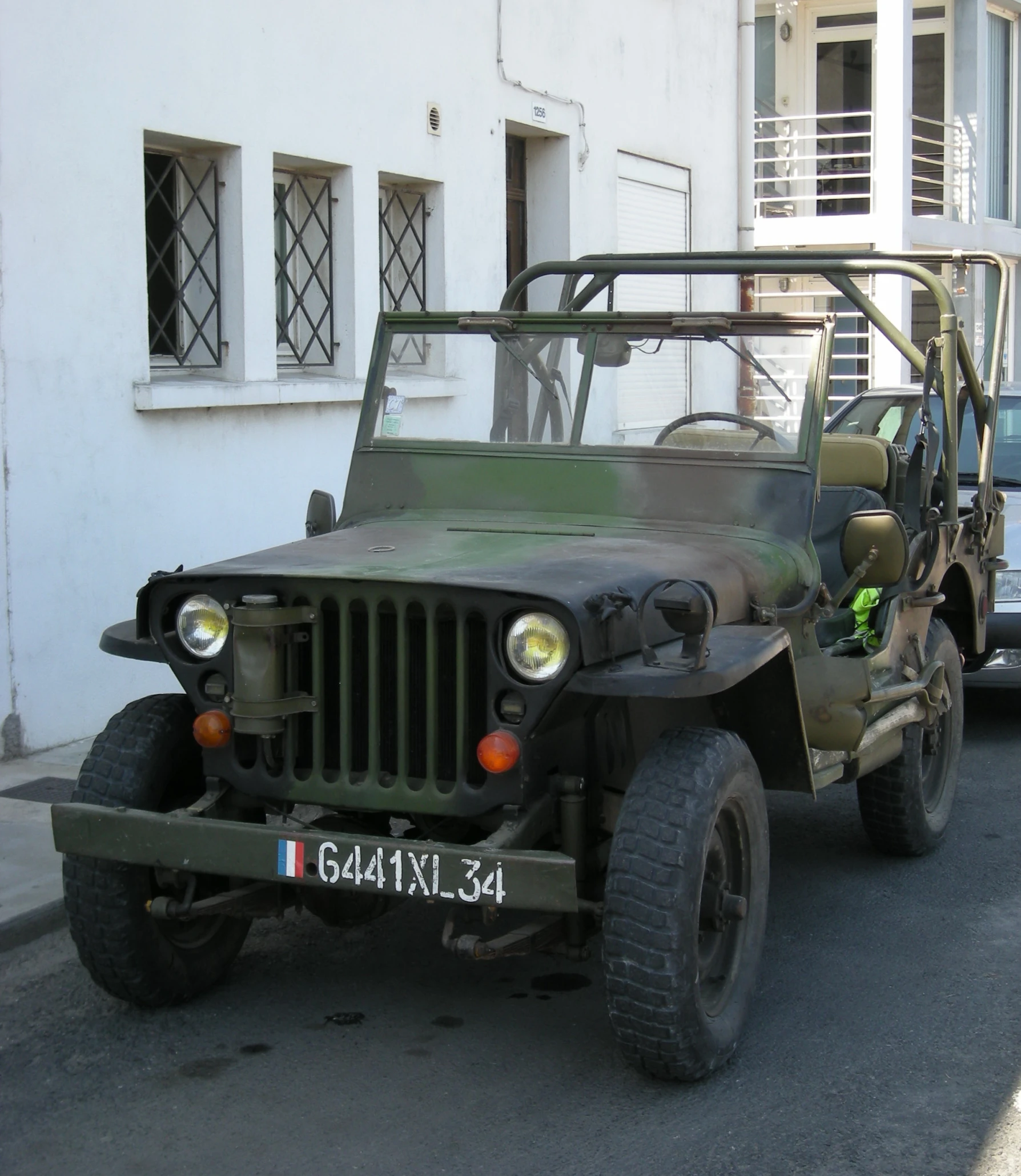a military vehicle parked in front of a building