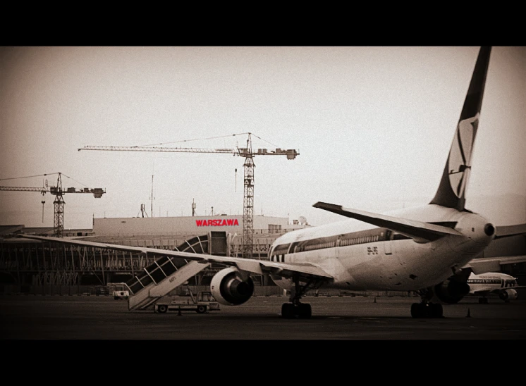 a passenger plane parked in front of the air port