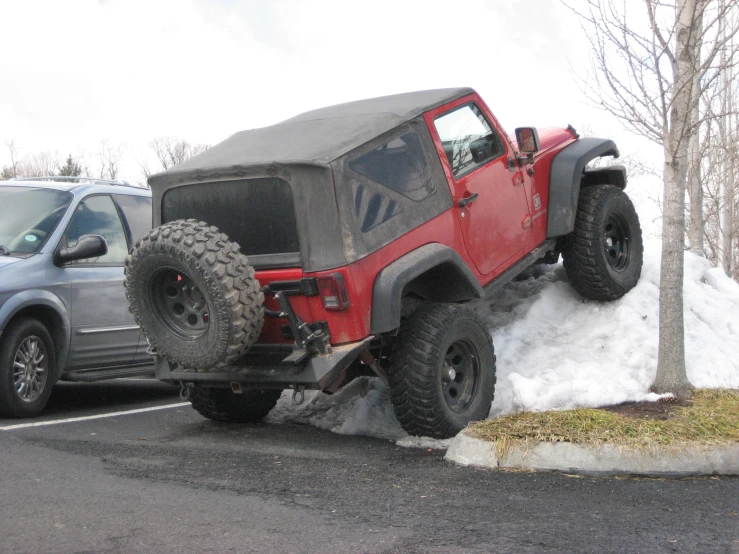 a jeep that is being lifted off of the ground