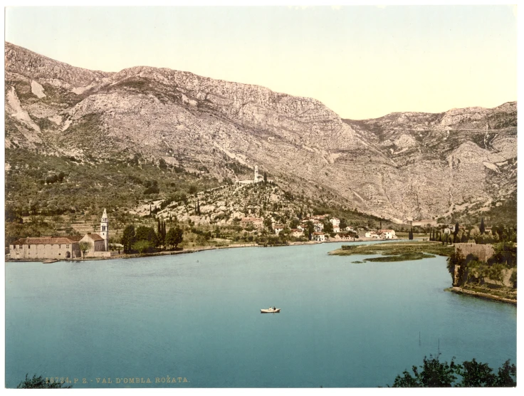 a lake with mountains in the background