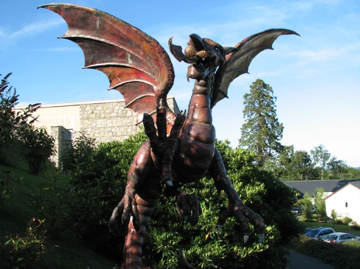 large dragon statue with wings spread from its body