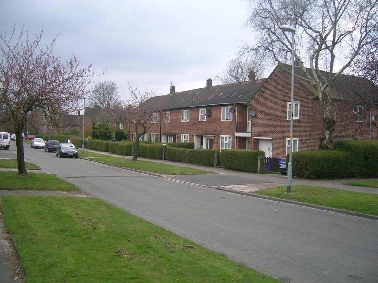 several residential houses, including one with an attached parking lot