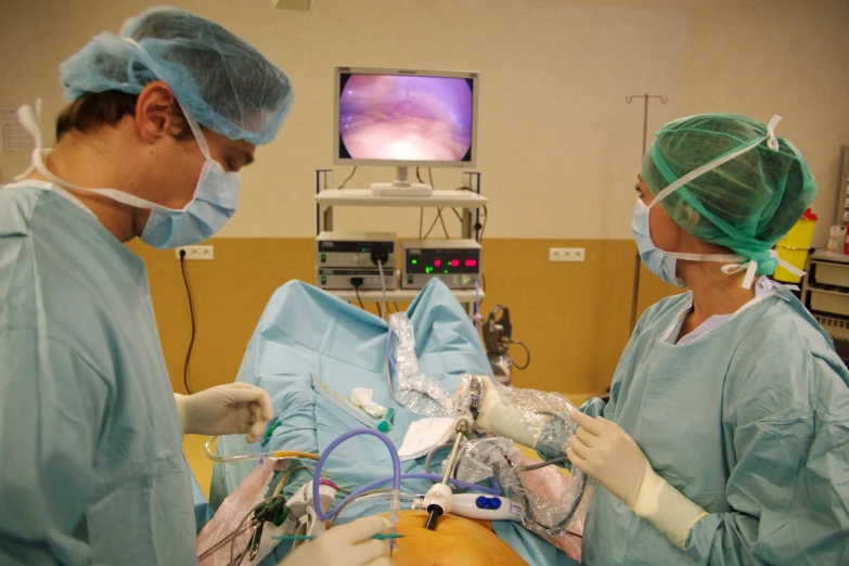 surgeons are preparing to perform operation on a patient