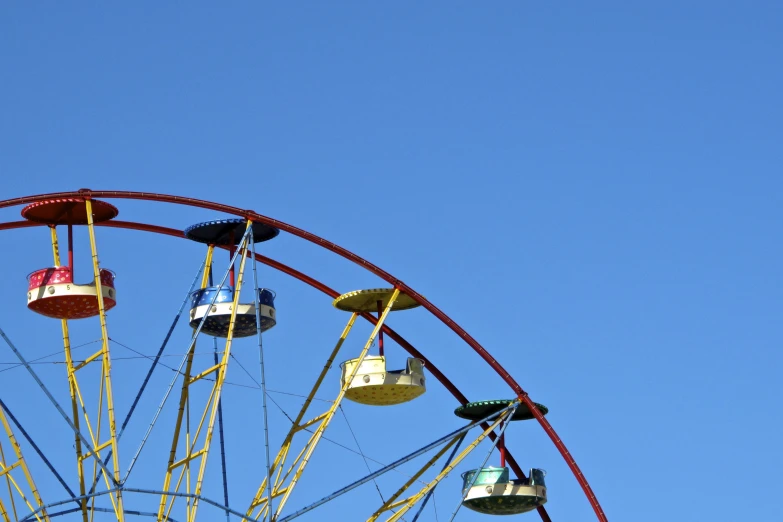 an amut ride that is spinning on a clear day