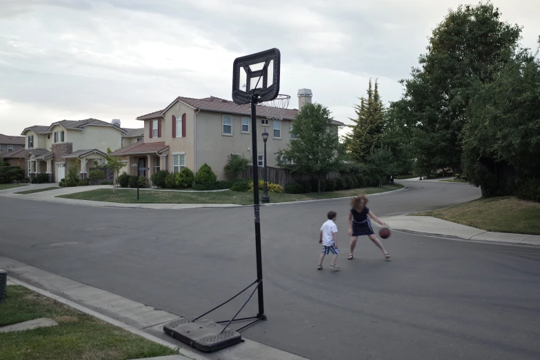 two people walking down a street with their bags