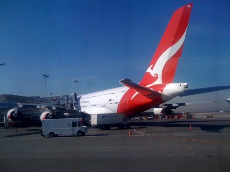 the airplane is red white and silver