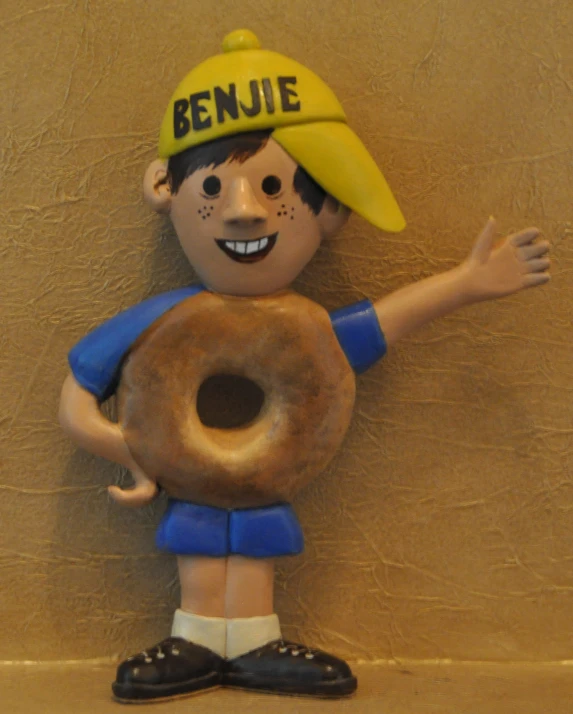 a  is holding a doughnut in his hands