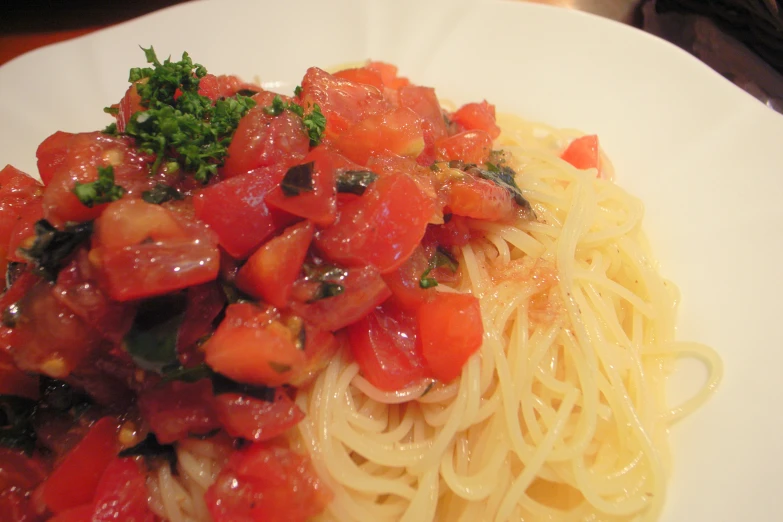 a plate that has spaghetti and meat on it