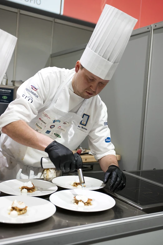 a chef preparing a dish at a restaurant