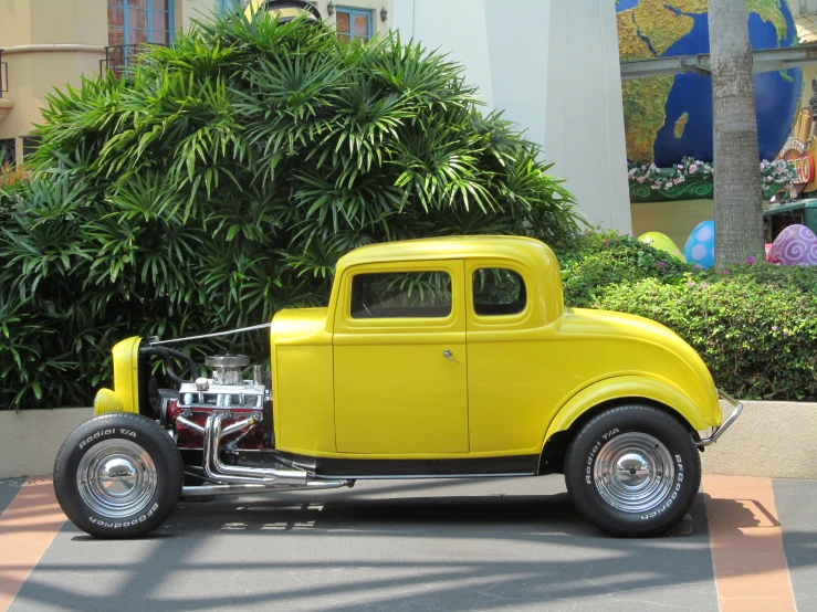 an old car is parked in the parking lot