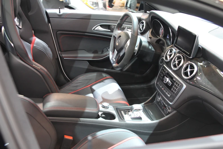 the interior of a vehicle with steering wheel and dashboard