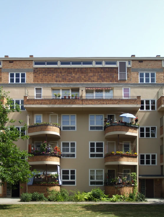 a building is shown with multiple balconies on each story