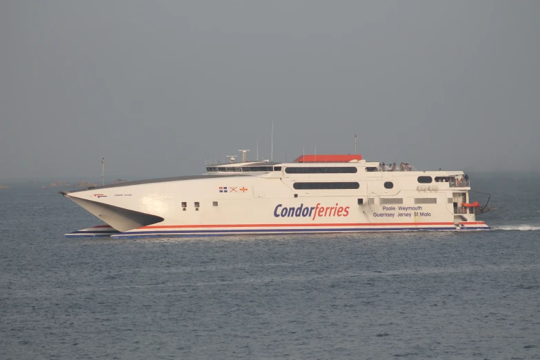 large ferry boat going fast in the ocean