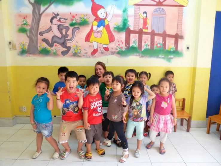 a group of children are posing for the camera