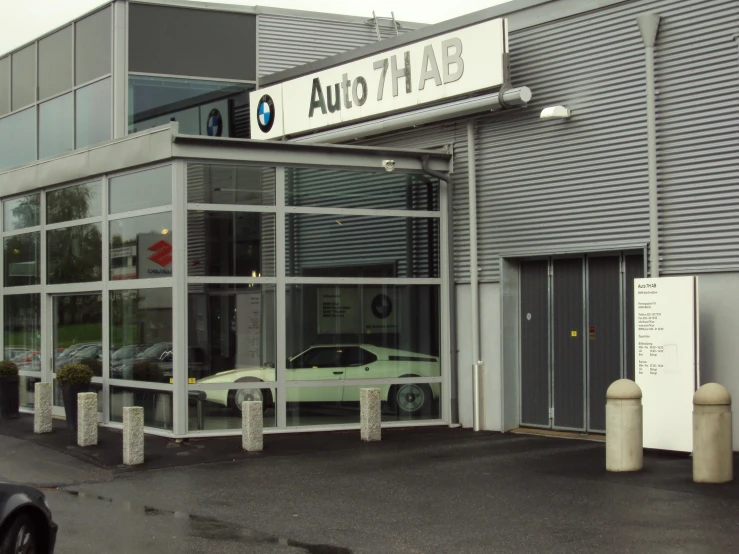 an automobile showroom with a car inside