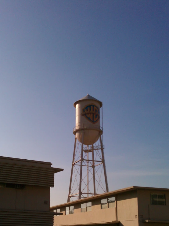 a water tower near a building with two garages