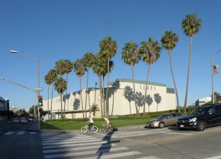 cars and bicyclists riding on a city street