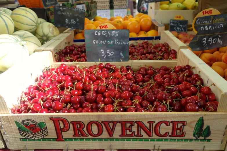 wooden crates of fruits for sale at a produce market